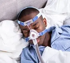 CPAP machine being worn by sleep apnea sufferer