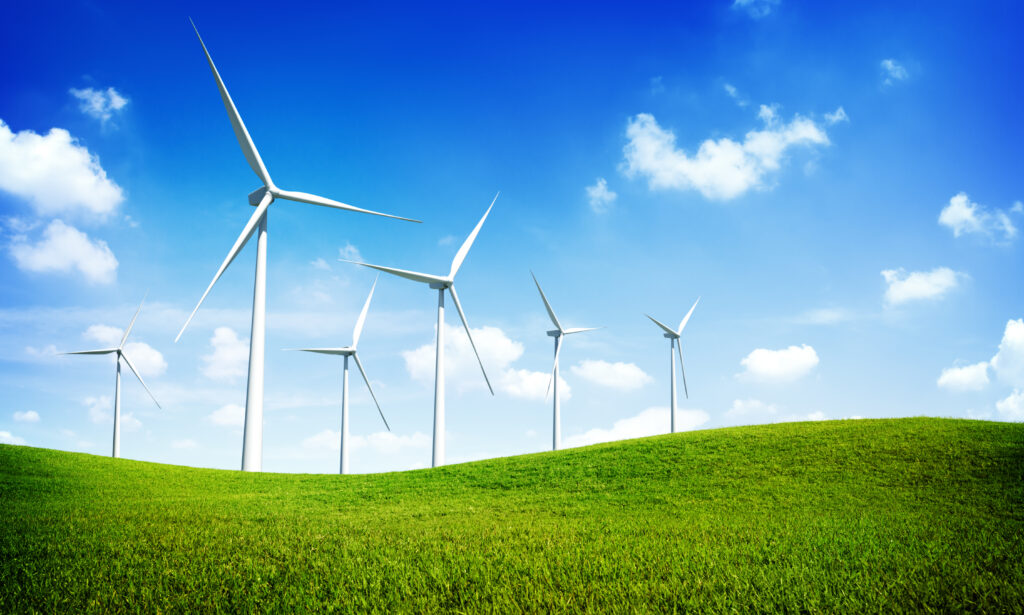 turbine windmills in open fields under blue skies