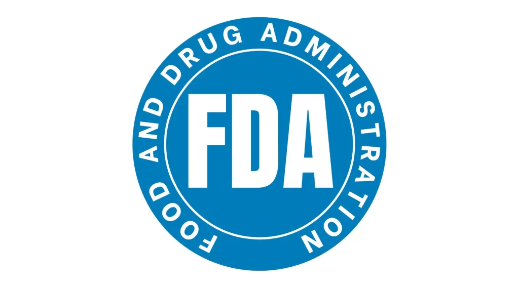 A circular blue logo with the white text "FDA" in the center. Surrounding this text in the outer ring are the words "FOOD AND DRUG ADMINISTRATION" in white.